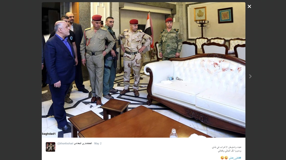 Iraqi PM Haider al-Abadi looking despondently at a stained counch