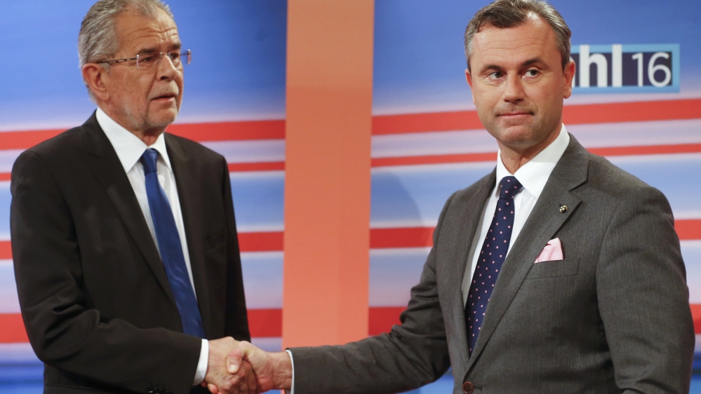 Presidential candidates Hofer and Van der Bellen shake hands before TV debate after Austrian presidential election in Vienna