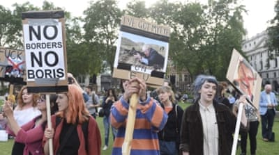 Protesters outside the Houses of Parliament on the day David Cameron announced his resignation after losing the vote in the EU Referendum in London, Britain [EPA]
