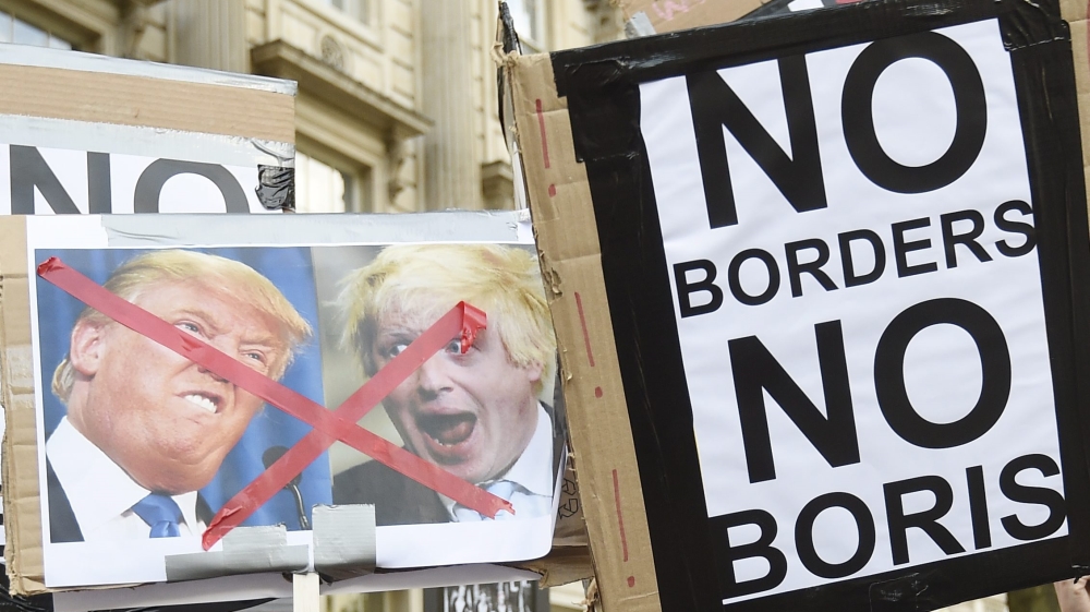 Protestors gather outside N10 Downing Street on the day British Prime Minister David Cameron announed his resignation in London, Britain [EPA]