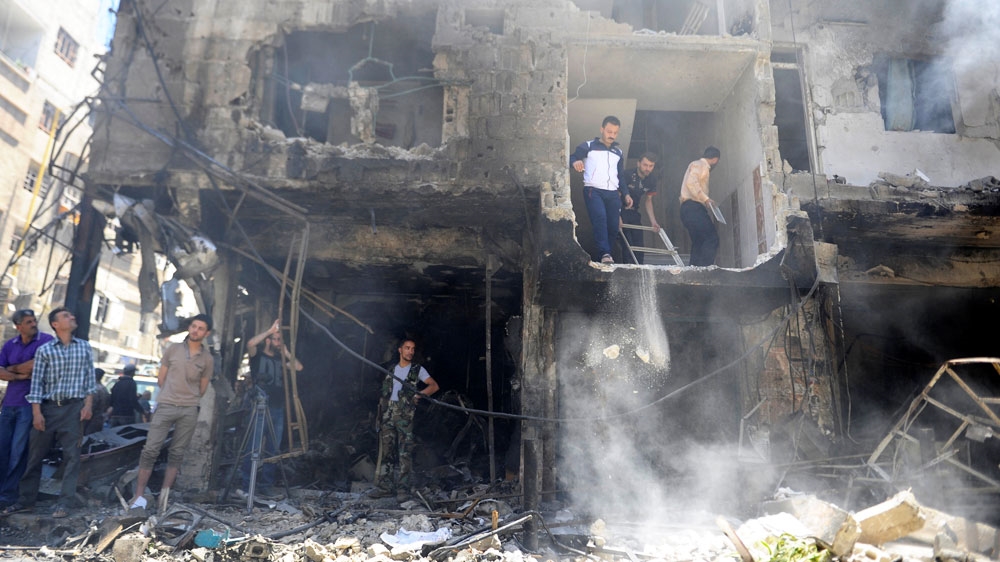 The shrine, about 10km south of the centre of Damascus, is heavily guarded by pro-government forces [Reuters]