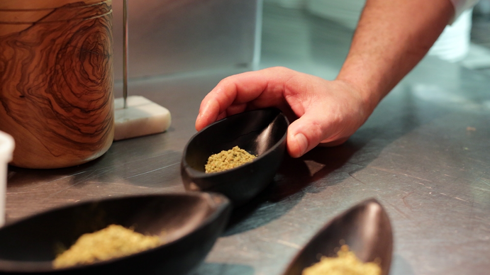 Za'atar , a mix of thyme and other spices well-known in Syria and Lebanon, made it on to the tables of L'Ami Jean in Paris [Micah Garen/Al Jazeera]