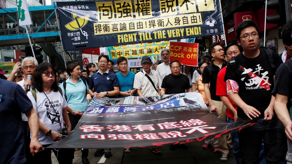 Bookseller Lam Wing-kee takes part in a protest march with pro-democracy lawmakers and supporters in Hong Kong