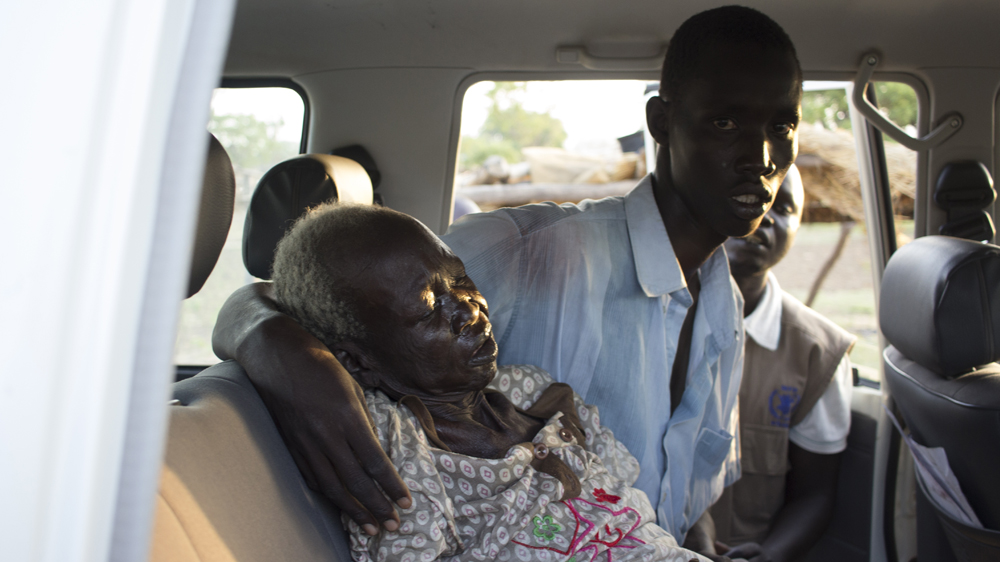 Abang Akok was taken to hospital in the back of a WFP vehicle [Henry Wilkins/Al Jazeera]