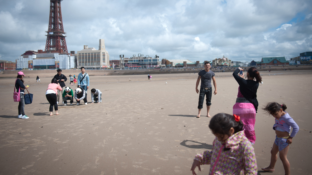 The Stan family, Romanian Roma now living in Manchester, enjoy a day out in Blackpool [Ciara Leeming/Al Jazeera]
