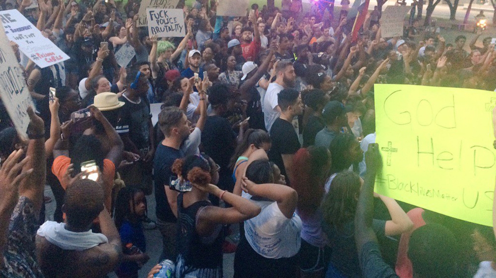  Marchers in Dallas protest against police shootings of two black men in Louisiana and Minnesota [Dallas Police Department/Reuters]