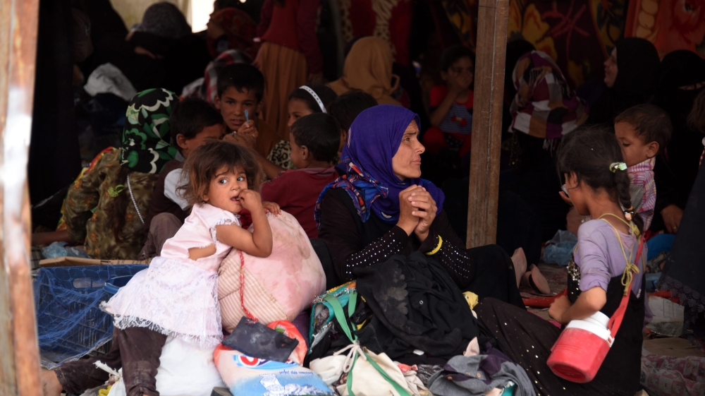 Displaced Iraqis from Fallujah stranded in Amariyat Al Fallujah, just before the Bzeibiz Bridge, waiting to be allowed into Baghdad, Iraq [EPA]