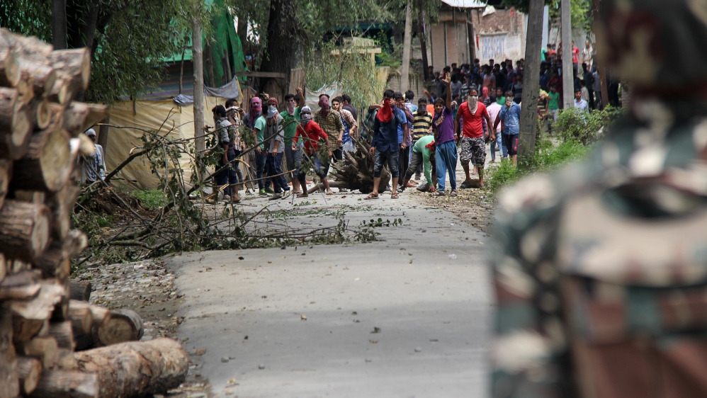 Young protesters in Bijbehara town, Anantnag district, seen confronting the security forces [Aarabu Ahmad Sultan/Al Jazeera]
