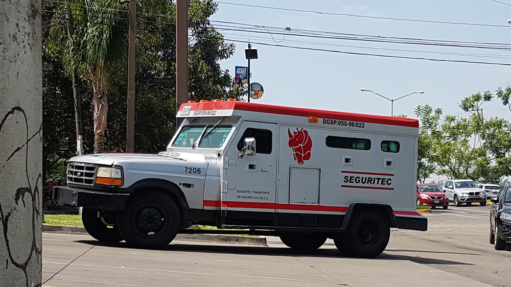 A Seguritec van rumbles through Guadalajara. Seguritec is a private security firm that specialises in transporting valuable goods [Duncan Tucker/Al Jazeera]