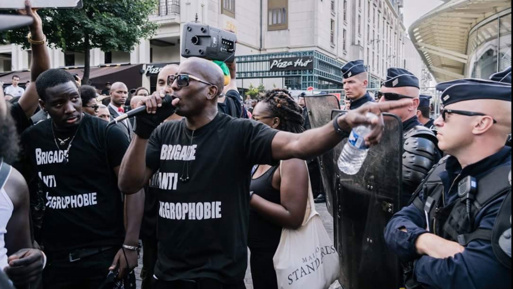 'Franco Lollia speaking at a Black Lives Matter Protest in the heart of Paris [Courtesy of collectif des Associations Unies Solitaires pour l'Afrique et sa Renaissance]