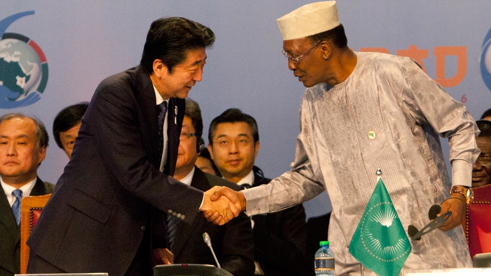 Japanese PM Shinzo Abe shakes hands with Chad President Idriss Deby