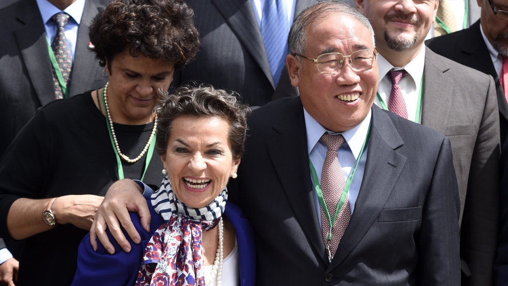 China's special representative for climate change Zhenhua Xie with Christiana Figueres, a Costa Rican climate change expert and a candidate for the secretary-general position [Miguel Medina/EPA]