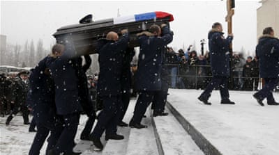 Fellow pilots carry the body of Oleg Peshkov, the Russian pilot of the downed SU-24 jet, during a memorial service in Lipetsk, Russia [Reuters]