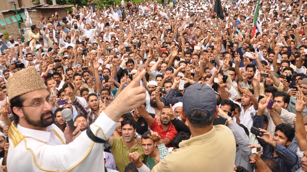 Separatist leader Mirwaiz Umar Farooq addresses supporters at a protest in June against a government plan to build a residential colony for the army in Kashmir [Aarabu Ahmad Sultan/Al Jazeera]