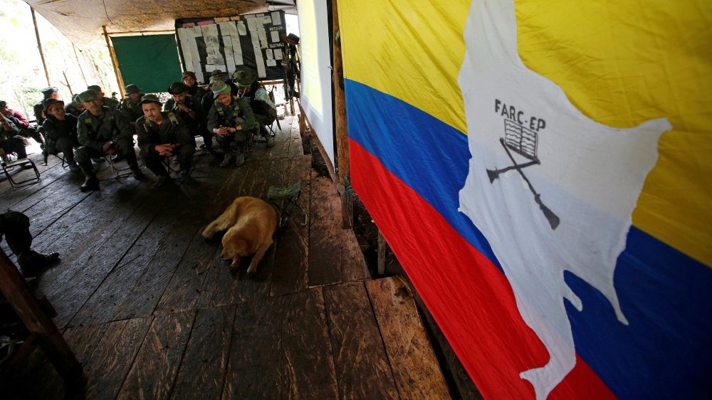 Members of the 51st Front of the Revolutionary Armed Forces of Colombia (FARC) listen to a lecture on the peace process between the Colombian government and their force at a camp in Cordillera Orienta