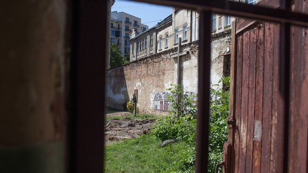 Researchers uncovered more than a dozen human remains in the courtyard of the Lontsky Prison, which is now a museum to local victims of repression [Dan Peleschuk/ Al Jazeera]