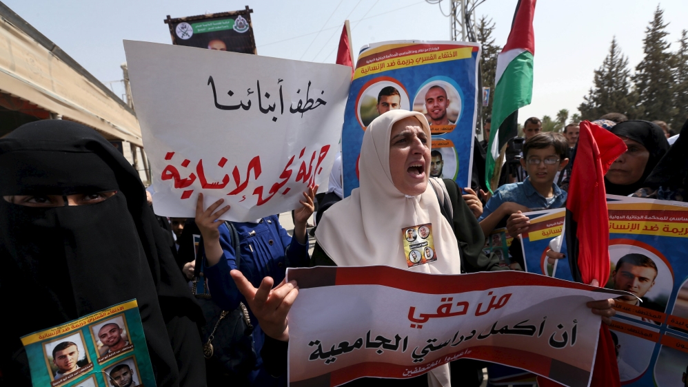 Demonstrators take part in a protest against the abduction of four Palestinians in Egypt''s Sinai last month, at the gate of Rafah crossing between Egypt and southern Gaza Strip