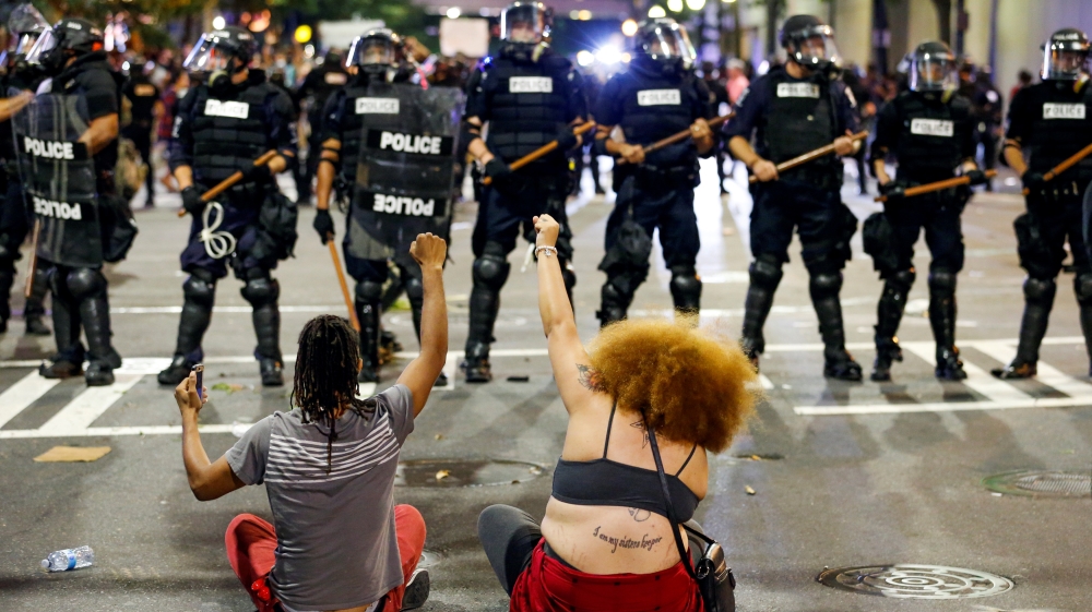 Authorities said 16 officers and several demonstrators were injured in Tuesday's clashes [Jason Miczek/Reuters]