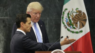 Trump, right, and Mexico's President Pena Nieto arrive for a press conference at the Los Pinos residence in Mexico City [Reuters]