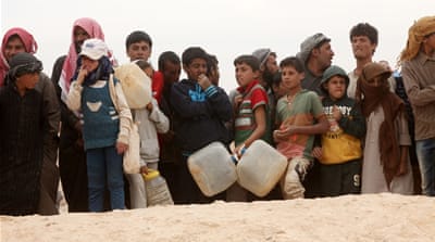Syrian refugees arrive at the Jordanian military crossing point of Hadalat at the Syria-Jordan border, March 2016 [Getty]