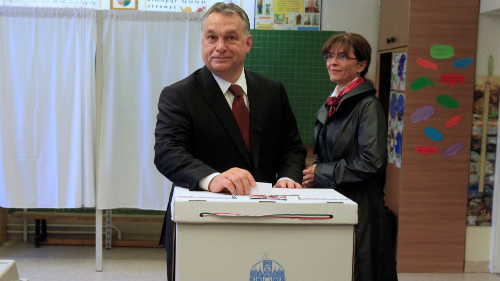 Hungary''s Prime Minister Orban casts his ballot next to his wife Levai inside a polling station during a referendum on EU migrant quotas in Budapest