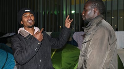 Fatah Rahman al-Hazeen, left, with his friend Abdul Ali, both from Sudan. Hazeen has just arrived from Calais [Lorraine Mallinder/Al Jazeera] 