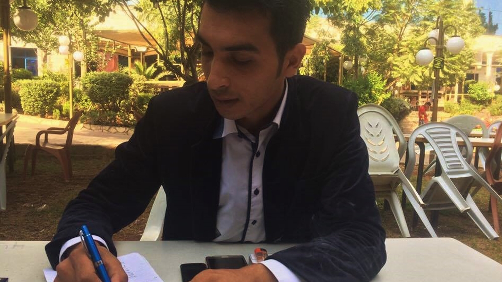  Aqeel Awawadi believes that if he had stayed at Sanabel Radio, he would now be in prison with his colleagues [Sheren Khalel/Al Jazeera] 