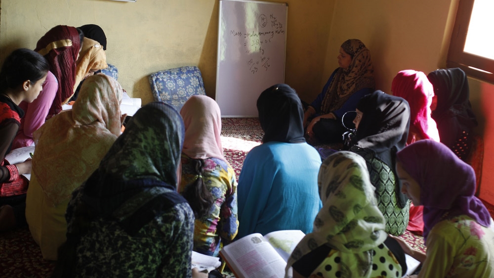 Students study chemistry at a religious school building in a mosque compound in Srinagar's Bemina neighbourhood [Zahid Rafiq/Al Jazeera] 
