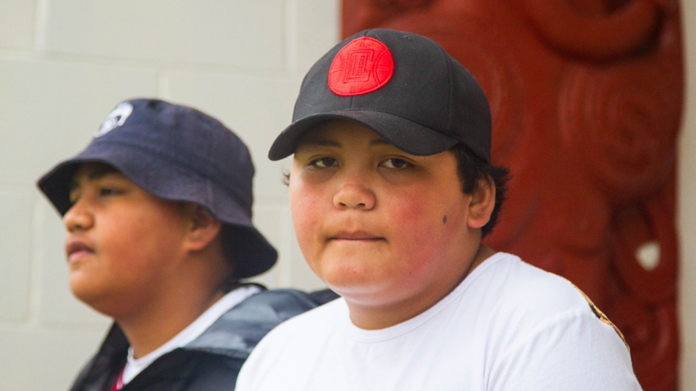 Brothers Michael and Bishop Allan are happy to now be living in social housing in the South Auckland suburb of Wiri [Caitlin McGee/Al Jazeera]