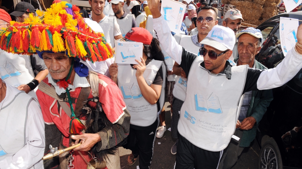 Supporters of the Party of Progress and Socialism (PPS) make their campaign for a parliamentary candidate in a market in Tifelt near Rabat [EPA]