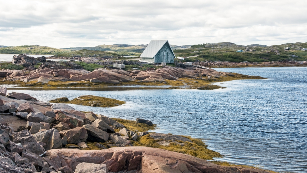 The wild outskirts of the shrinking fishing village of Tete-a-la-Baleine [John Zada/Al Jazeera]