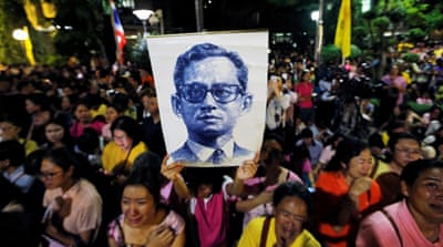 Well-wishers hold a picture of the king [Jorge Silva/Reuters]