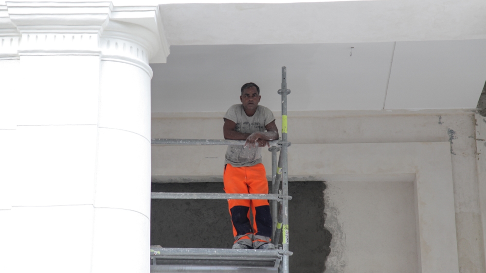 An Indian labourer on site at the Manzana de Gomez [Ed Augustin/Al Jazeera]