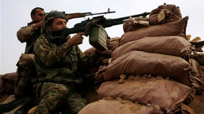 Kurdish Peshmerga fighters take their position during a battle with ISIL fighters near Mosul, Iraq [Reuters]