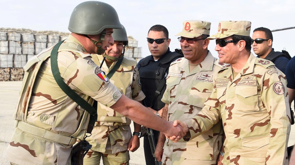 Egyptian President Sisi greets members of the Egyptian armed forces, after travelling to the troubled northern part of the Sinai peninsula to inspect troops