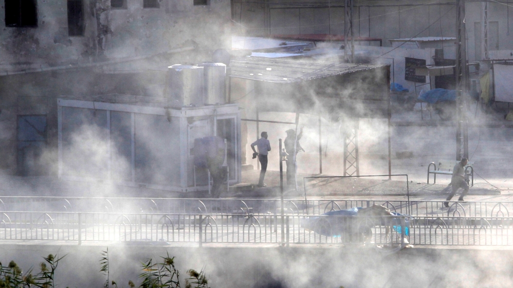 Smoke rises as Kurdish forces take up position at a site of an attack by Islamic State militants in Kirkuk