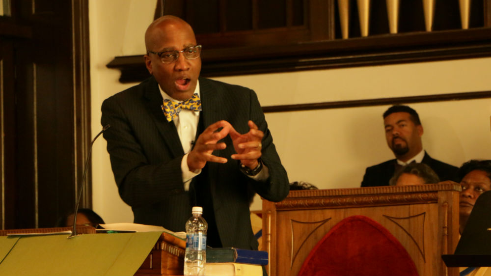 Pastor Nelson reminds the congregation to keep the church open and move with the times [Julienne Gage/Al Jazeera]