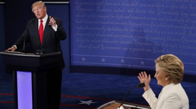 Trump speaks as Clinton listens during their third and final 2016 presidential campaign debate at on October 19 [Reuters]