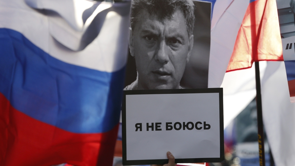 People commemorate Russian opposition politician Nemtsov on first anniversary of his murder in Moscow