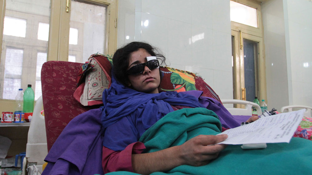  Shabrooza Akhtar’s mother Rafiqa Banoo says when news spread that the army was entering homes, villagers came out to protest. Akhter was hit on the lawn outside their house [Shuaib Masoodi/Al Jazeera]