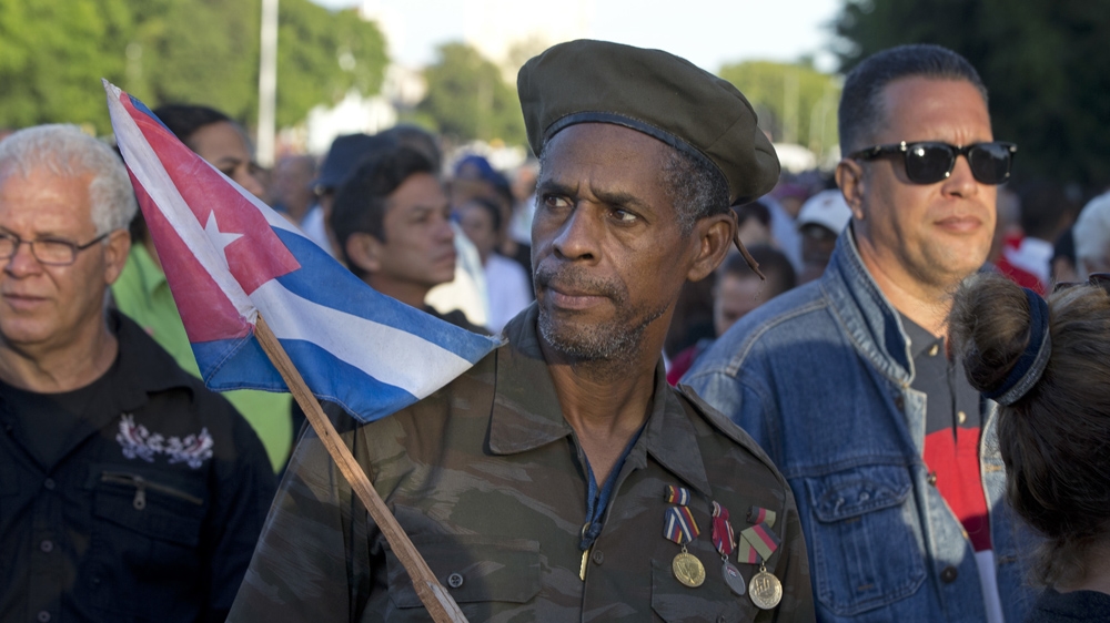 Ernesto Barbon, a veteran of the Angola war in which Cuban troops fought in the 1980s, waits in line to enter the Revolution PLaza, to pay homage to Fidel Castro in Havana [Ricardo Mazalan/AP]