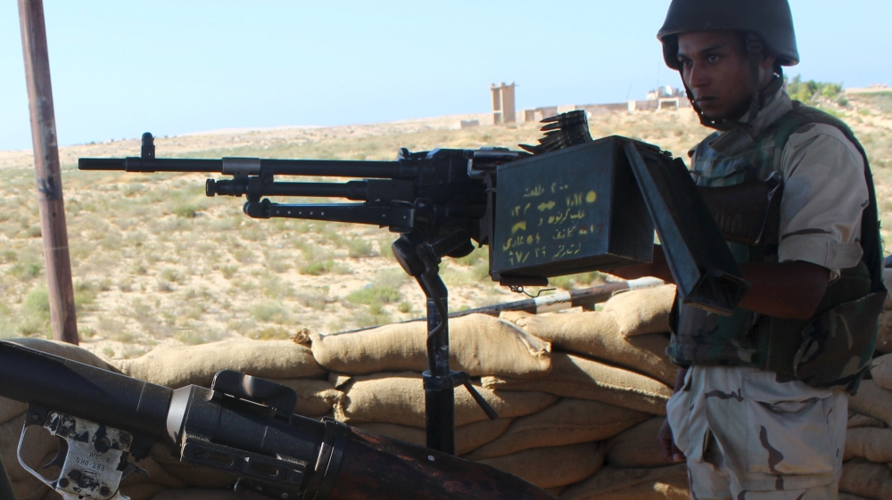 An Egyptian army soldier looks on from his postion at a checkpoint in Al Arish city, the troubled northern part of the Sinai peninsula