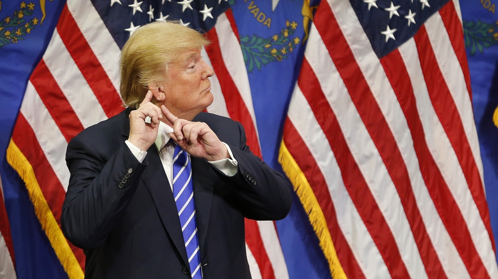 Donald Trump reacts after speaking at a rally , in Las Vegas