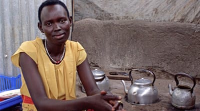 Akuol Ayiik, 20, runs a tea-room in Nyumanzi serving traditional Sudanese hot beverages to the community [Tendai Marima/Al Jazeera]