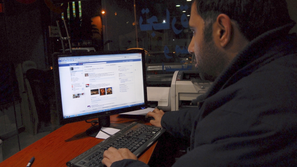 A Syrian man connects on his Facebook account
