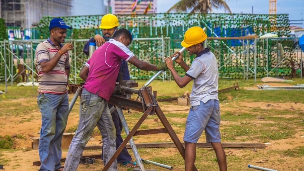 
Now many, including the port engineers who had offered structural advice, have chosen to work overtime, without pay [Angelo Samarawickrema /Al Jazeera]
