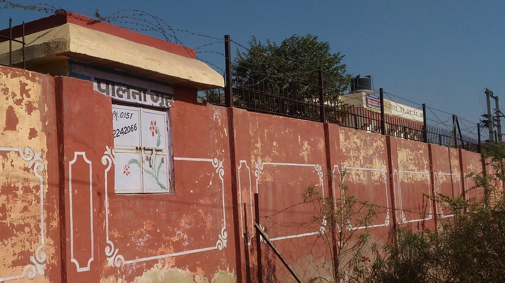 The roadside view of the cradle home built at the adoption agency in Bikaner. One door opens on the roadside to allow parents to leave the babies unnoticed; the babies are then received by adoption authorities once the alarm rings, from a door that opens on the inside of the compound. [Shaifali Agrawal/Al Jazeera]
