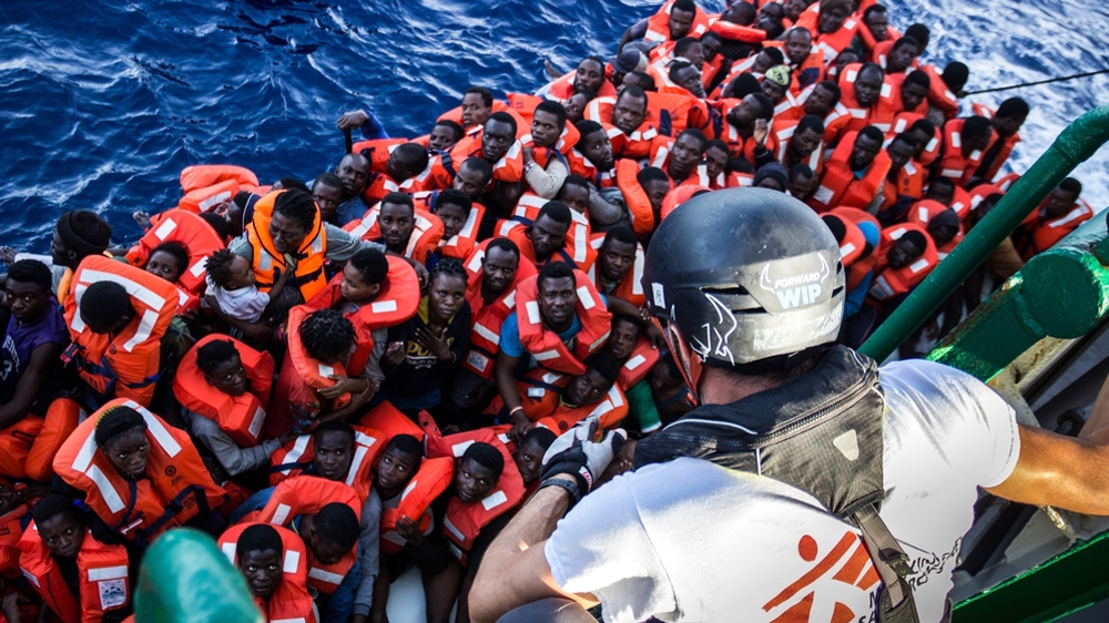  MSF field coordinator Michele Telaro explains procedures to people coming on board the Bourbon Argos [ Borja Ruiz Rodriguez/MSF ] 
