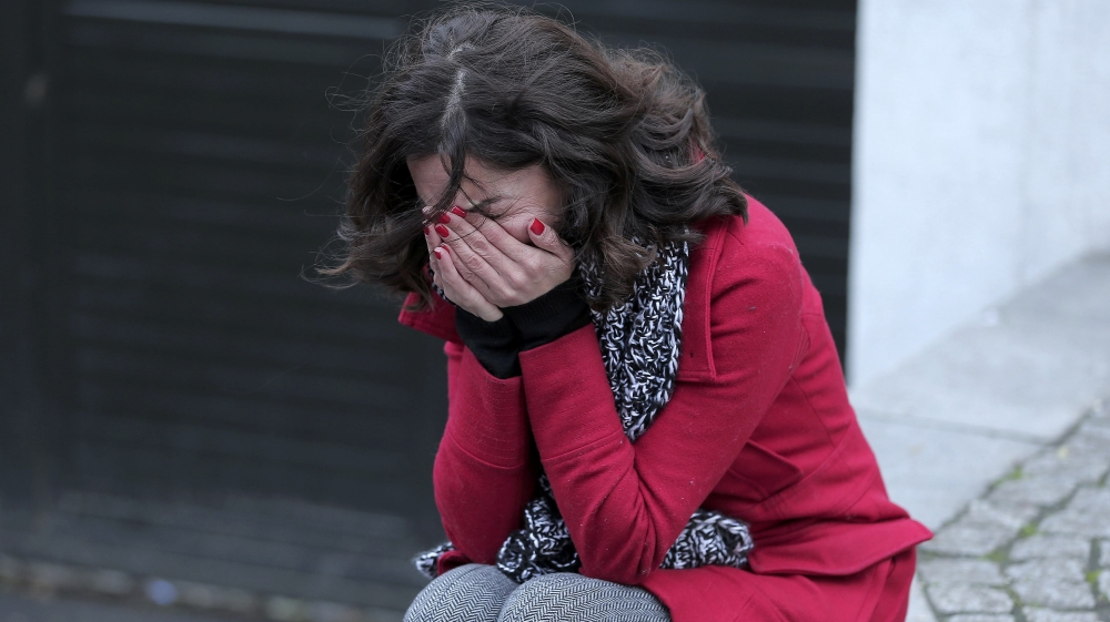 A former employee of the Reina nightclub cries following the attack [Huseyin Aldemir/Reuters]