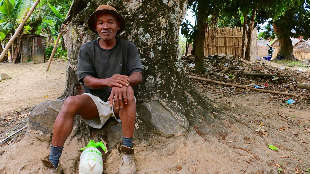 Unlike many farmers, Moara wears shoes. Though missing laces, they still protect his feet from the sharp branches, thorns and sticks [Peter Lind/Danwatch]